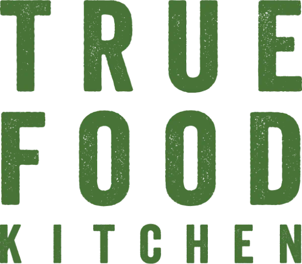 Green text spelling "True Food Kitchen" on a white background. The letters are bold and aligned vertically.